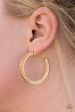 Load image into Gallery viewer, Etched in a scratched shimmer, a flat gold bar curls around the ear, creating a blinding sparkle. Earring attaches to a standard post fitting. Hoop measures 1 1/2” in diameter.  Sold as one pair of hoop earrings.
