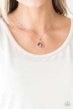 Load image into Gallery viewer, Shimmery silver bars curl around a brown teardrop moonstone, creating an elegant heart shaped pendant below the collar. Features an adjustable clasp closure.  Sold as one individual necklace. Includes one pair of matching earrings.
