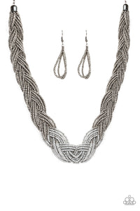 Strands of gunmetal seed beads create an indigenous braid below the collar. The gunmetal seed beads gradually morph into metallic silver beads at the center for a chic contrasting look. Features an adjustable clasp closure. Sold as one individual necklace. Includes one pair of matching earrings.