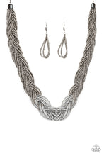 Load image into Gallery viewer, Strands of gunmetal seed beads create an indigenous braid below the collar. The gunmetal seed beads gradually morph into metallic silver beads at the center for a chic contrasting look. Features an adjustable clasp closure.  Sold as one individual necklace. Includes one pair of matching earrings.
