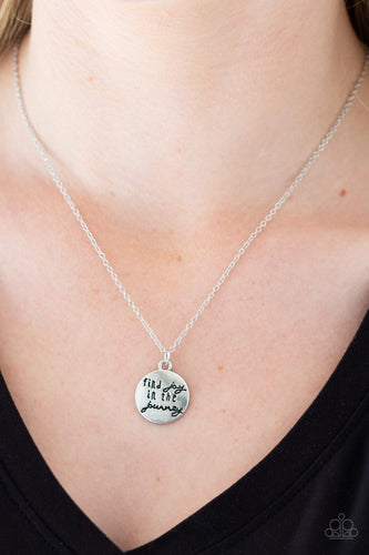 Stamped in the inspirational phrase, 