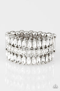 Featuring refined marquise cuts, glittery white rhinestones flare from a center of glassy white rhinestones, creating a regal band across the finger. Features a stretchy band for a flexible fit. Sold as one individual ring.
