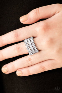 Featuring refined marquise cuts, glittery white rhinestones flare from a center of glassy white rhinestones, creating a regal band across the finger. Features a stretchy band for a flexible fit. Sold as one individual ring.