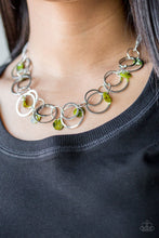 Load image into Gallery viewer, Bits of iridescent green shell swing from the bottoms of mismatched silver hoops below the collar for a summery look. Features an adjustable clasp closure.  Includes one pair of matching earrings.
