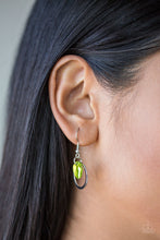 Load image into Gallery viewer, An iridescent green shell swing from a silver fish hook earring.
