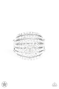 Row after row of incandescent white rhinestones stack into a dazzling display. The gorgeous rounded bands and undeniable sparkle create a regal blockbuster statement piece. Features a stretchy band for a flexible fit. Sold as one individual ring. 