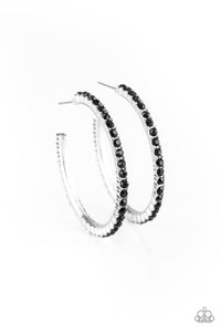 Encrusted in glassy black rhinestones, a textured silver hoop curls around the ear for a refined look. Earring attaches to a standard post fitting. Hoop measures 1 3/4" in diameter.  Sold as one pair of hoop earrings.