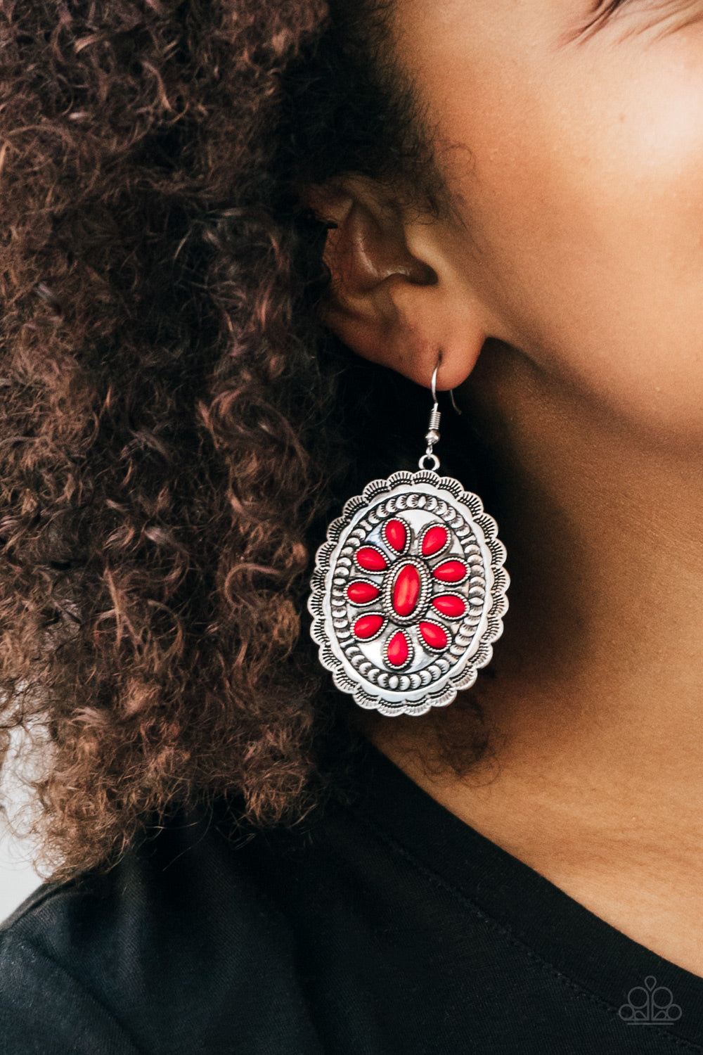 Fiery red stones dance across the front of a scalloped silver frame, coalescing into an earthy floral pattern for a seasonal finish. Earring attaches to a standard fishhook fitting. Sold as one pair of earrings.