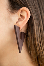 Load image into Gallery viewer, Painted in an earthy brown finish, a wooden frame is cut into an edgy triangular shape for a retro vibe. Earring attaches to a standard post fitting. Hoop measures approximately 1 1/2&quot; in diameter. Sold as one pair of hoop earrings.
