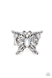 Lacy silver wings bloom from an opalescent blue cat's eye center, coalescing into a whimsical butterfly atop the finger. Features a stretchy band for a flexible fit. Sold as one individual ring.
