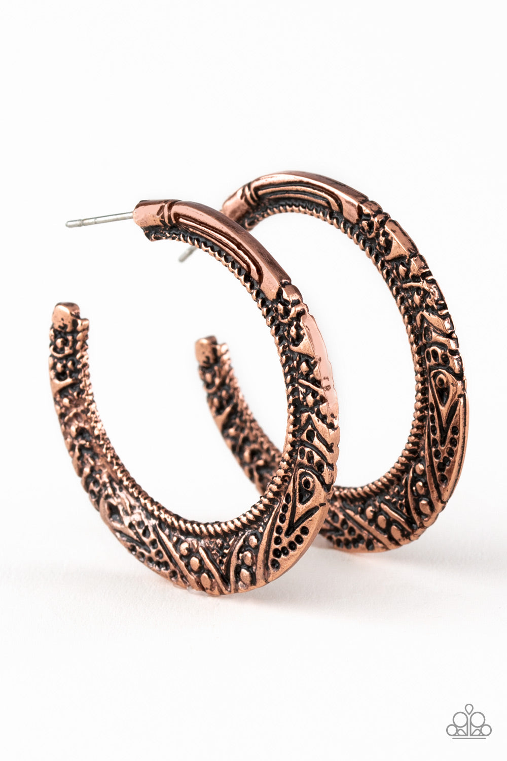 Stamped in tribal inspired patterns, a flattened copper bar curls around the ear for a seasonal look. Earring attaches to a standard post fitting. Hoop measures 1 1/2