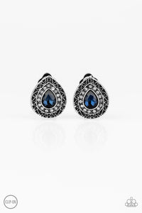 Encircled in glassy white rhinestones, a teardrop blue gem is pressed into the center of an ornate silver teardrop gem for a glamorous look. Earring attaches to a standard clip-on fitting.  Sold as one pair of clip-on earrings.