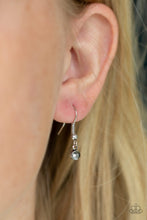 Load image into Gallery viewer, Small rhinestone hanging from a fish hook earring.
