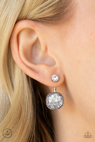 A solitaire white rhinestone attaches to a double-sided post, designed to fasten behind the ear. Featuring a faceted white gem, the glitzy double-sided post peeks out beneath the ear for a refined look. Earring attaches to a standard post fitting.  Sold as one pair of double-sided post earrings.