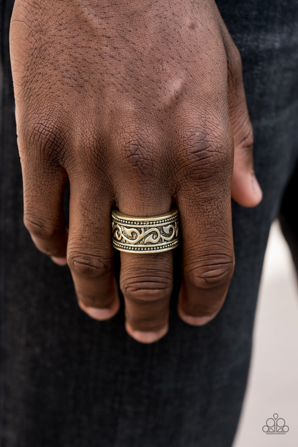 A thick antiqued brass band has been embossed in a vine-like pattern for a rugged look. Features a stretchy band for a flexible fit.  Sold as one individual ring.