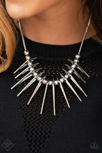 Load image into Gallery viewer, Separated by bold silver beads, triangular silver frames gradually increase in intensity as they slide along a rounded silver snake chain, creating an electric fringe below the collar. Features an adjustable clasp closure.  Sold as one individual necklace. Includes one pair of matching earrings.
