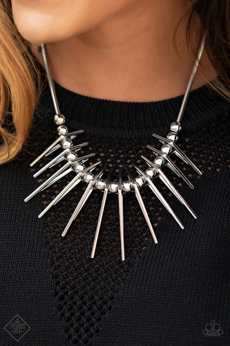 Separated by bold silver beads, triangular silver frames gradually increase in intensity as they slide along a rounded silver snake chain, creating an electric fringe below the collar. Features an adjustable clasp closure.  Sold as one individual necklace. Includes one pair of matching earrings.
