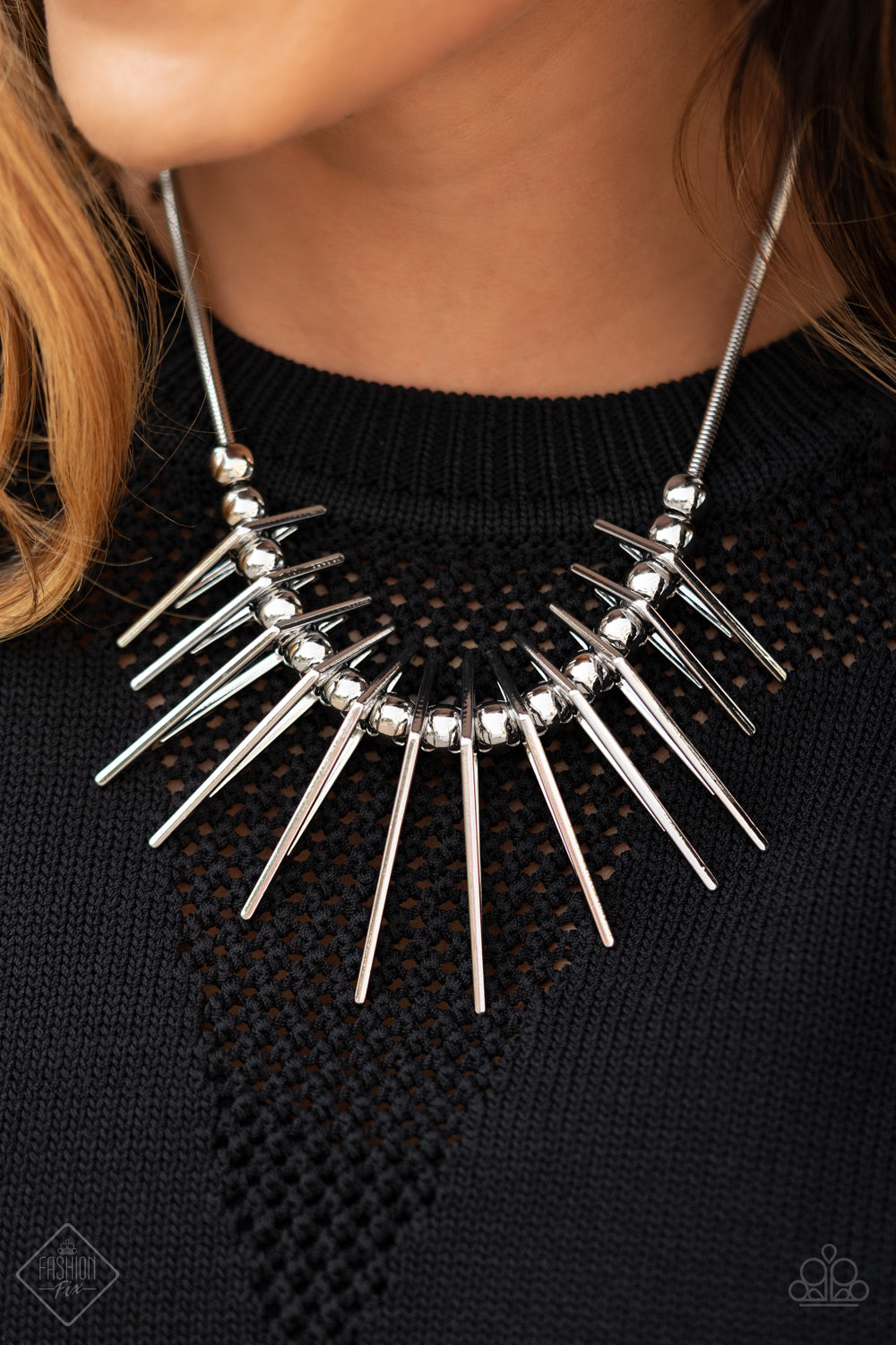 Separated by bold silver beads, triangular silver frames gradually increase in intensity as they slide along a rounded silver snake chain, creating an electric fringe below the collar. Features an adjustable clasp closure.  Sold as one individual necklace. Includes one pair of matching earrings.