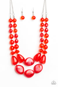 Varying in shape and opacity, a refreshing collection of glassy and iridescent red beads layer below the collar for a boldly colorful look. Features an adjustable clasp closure. Sold as one individual necklace. Includes one pair of matching earrings.
