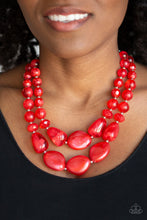 Load image into Gallery viewer, Varying in shape and opacity, a refreshing collection of glassy and iridescent red beads layer below the collar for a boldly colorful look. Features an adjustable clasp closure. Sold as one individual necklace. Includes one pair of matching earrings.
