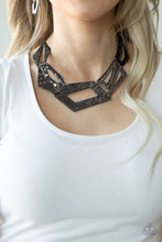 Load image into Gallery viewer, Attached to an edgy gunmetal chain, hammered gunmetal plates featuring asymmetrical shapes abstractly link below the collar for a knockout look. Features an adjustable clasp closure.  Sold as one individual necklace. Includes one pair of matching earrings.
