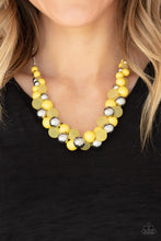 Load image into Gallery viewer, A bubbly collection of imperfect silver, opaque, and yellow beads are threaded along an invisible wire below the collar, creating a colorful cluster. Features an adjustable clasp closure.  Sold as one individual necklace. Includes one pair of matching earrings.
