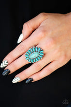 Load image into Gallery viewer, Refreshing turquoise stones are pressed into a studded silver frame, coalescing into a whimsical floral centerpiece atop the finger. Features a stretchy band for a flexible fit. Sold as one individual ring.

