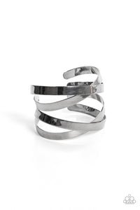 Brushed in a high-sheen finish, two sets of flat gunmetal bands crisscross over the wrist as they wrap into a lustrous cuff giving off an industrial vibe.  Sold as one individual bracelet.