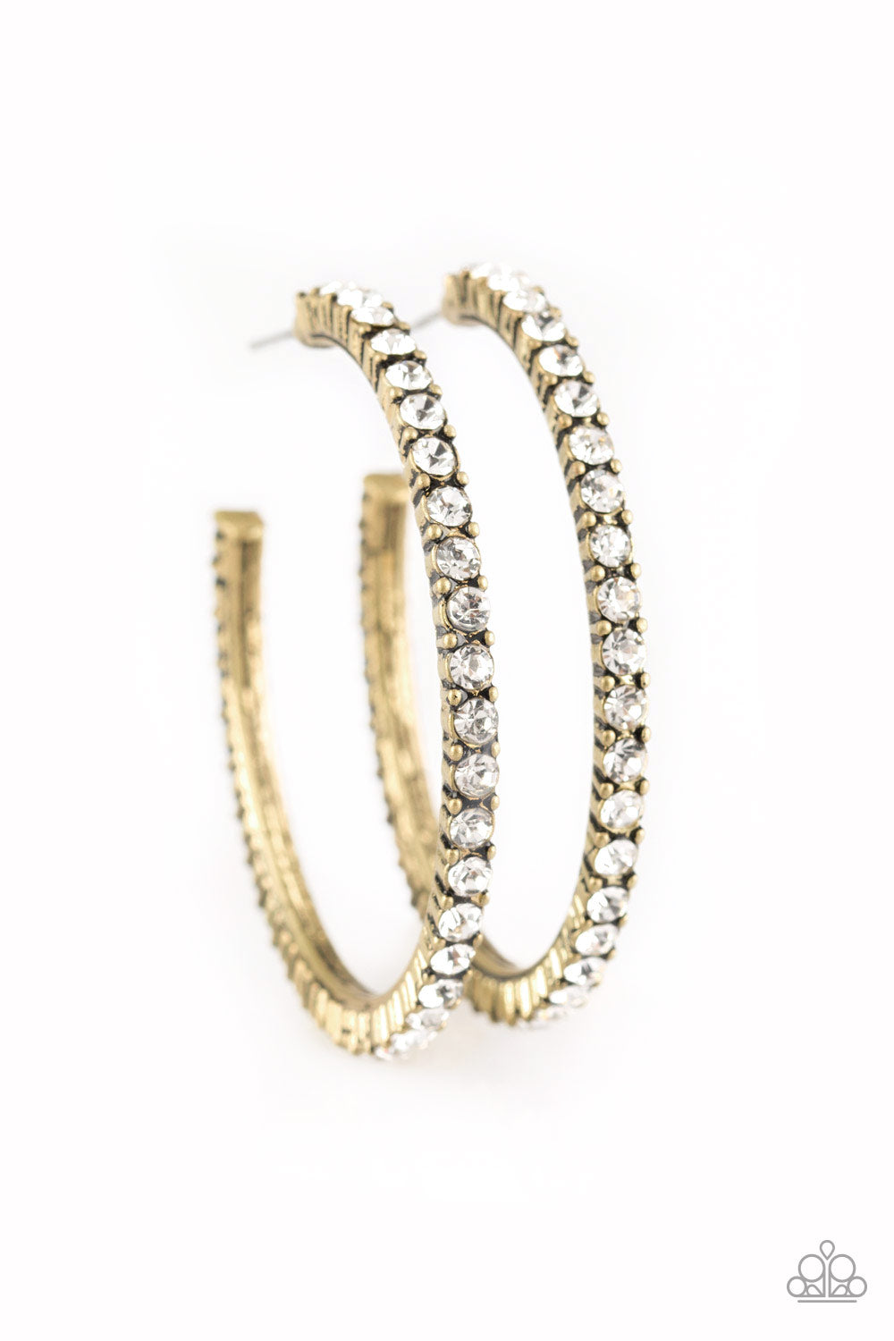 Encrusted in glassy white rhinestones, a textured brass hoop curls around the ear for a refined look. Earring attaches to a standard post fitting. Hoop measures 1 3/4