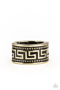 A thick brass band is studded and embossed in a tribal inspired pattern for an edgy look. Features a stretchy band for a flexible fit.  Sold as one individual ring.