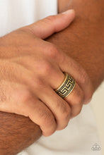 Load image into Gallery viewer, A thick brass band is studded and embossed in a tribal inspired pattern for an edgy look. Features a stretchy band for a flexible fit.  Sold as one individual ring.
