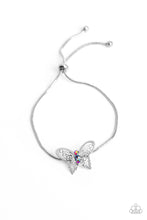 Load image into Gallery viewer, A deceptively simple silver butterfly charm glides along a silver snake chain for a whimsical flair along the wrist. Dainty, pink rhinestones, brushed in a UV shimmer, encrust along the butterfly&#39;s body, creating an understated shimmer, while intricate, airy wings fold out from the sparkle, adding a 3D effect to the design. Features an adjustable sliding knot closure. Due to its prismatic palette, color may vary.  Sold as one individual bracelet.
