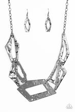 Load image into Gallery viewer, Attached to an edgy gunmetal chain, hammered gunmetal plates featuring asymmetrical shapes abstractly link below the collar for a knockout look. Features an adjustable clasp closure.  Sold as one individual necklace. Includes one pair of matching earrings.
