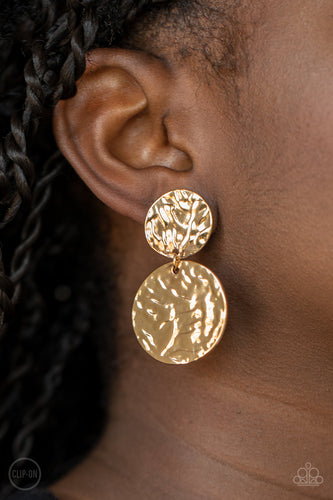 Varying in size, hammered gold discs link into a rippling lure. Earring attaches to a standard clip-on fitting.  Sold as one pair of clip-on earrings.