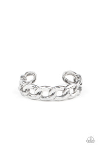 Brushed in an antiqued shimmer, oversized silver chain links boldly connect into a gritty cuff around the wrist.  Sold as one individual bracelet.