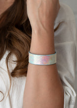 Load image into Gallery viewer, Featuring an iridescently foiled finish, a blue leather band delicately curls into a colorfully retro cuff around the wrist for a stellar fashion.  Sold as one individual bracelet.
