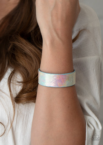 Featuring an iridescently foiled finish, a blue leather band delicately curls into a colorfully retro cuff around the wrist for a stellar fashion.  Sold as one individual bracelet.
