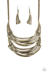 Stamped in sections of vine-like patterns, abstract hammered plates and overlapping brass bars link into an exaggerated pendant below the collar for a statement-making look. Features an adjustable clasp closure.  Sold as one individual necklace. Includes one pair of matching earrings.