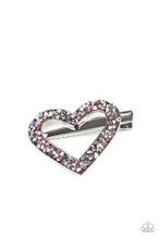 Load image into Gallery viewer, A glittery collision of hematite and purple iridescent rhinestones scatter across the front of a shiny silver heart frame for a colorful look. Features a standard hair clip on the back.  Sold as one individual hair clip.

