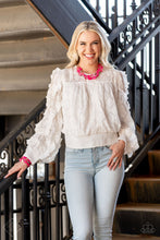 Load image into Gallery viewer, Varying in shape and opacity, a vibrant collection of faceted and smooth Raspberry Sorbet beads join textured silver discs and dainty silver beads along two thin wires, layering into a flamboyant pop of color below the collar. Features an adjustable clasp closure. Includes one pair of matching earrings. Glassy and opaque Raspberry Sorbet crystal-like beads and textured silver accents are threaded along stretchy bands around the wrist, creating vivacious layers. Showing a complete look on a model.
