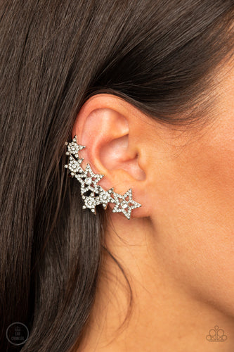 A stellar display of white rhinestone encrusted stars curve up the ear, coalescing into a sparkle-spangled statement piece. Earring attaches to a standard post fitting. Features a clip-on fitting on the back for a secure fit.  Sold as one pair of ear crawlers.