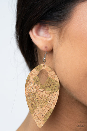 Spotted in rustic Military Olive accents, a flat cork teardrop is spliced into a rippling frame for an earthy fashion. Earring attaches to a standard fishhook fitting.  Sold as one pair of earrings.