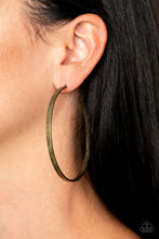 Load image into Gallery viewer, An antiqued brass hoop curls into an exaggerated curve for a rustic finish. Earring attaches to a standard post fitting. Hoop measures approximately 2 3/4&quot; in diameter.  Sold as one pair of hoop earrings.
