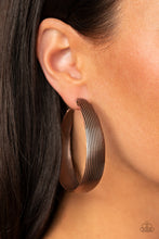 Load image into Gallery viewer, Lined in antiqued ridges, a thick copper hoop curls around the ear for an authentically rustic look. Earring attaches to a standard post fitting. Hoop measures approximately 2 ¼” in diameter.  Sold as one pair of hoop earrings.
