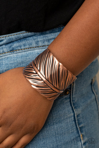 Embossed in life-like texture, an antiqued copper feather delicately curls around the wrist, creating a whimsical cuff.  Sold as one individual bracelet.