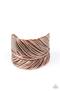 Embossed in life-like texture, an antiqued copper feather delicately curls around the wrist, creating a whimsical cuff.  Sold as one individual bracelet.