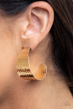 Load image into Gallery viewer, Delicately hammered in a shimmery finish, a flat gold frame curls into a curvy hoop for a chic finish. Earring attaches to a standard post fitting. Hoop measures approximately 1 1/2&quot; in diameter.  Sold as one pair of hoop earrings.
