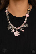 Load image into Gallery viewer, Pink cording is braided through a chunky silver chain. A unique variety of charms decorate the piece including a delicate flower and a heart inscribed with the phrase &quot;With All My Heart&quot; on one side and a short bible verse on the other that reads, &quot;Love the Lord thy God with all your heart. Luke 10:27.&quot; Features an adjustable clasp closure.  Sold as one individual necklace. Includes one pair of matching earrings.
