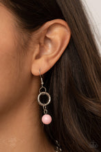 Load image into Gallery viewer, Pink bead hanging from a silver fish hook earring.
