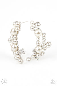 A collection of bubbly white pearls dot a shiny silver frame that branches up the ear for a modern, timeless twist. Earring attaches to a standard post fitting. Features a clip-on fitting at the top for a secure fit.  Sold as one pair of ear crawlers.
